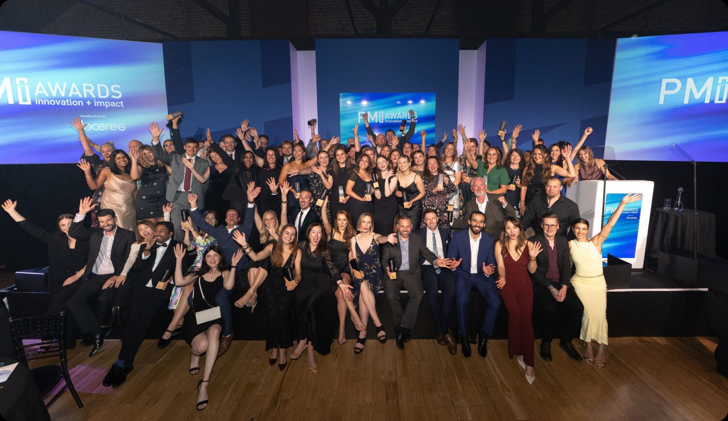 Winners celebrating on stage at the PM Society PMi Awards 2026